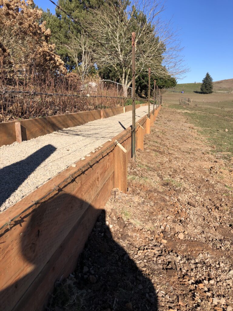 gravel pathway with wood retaining wall salem